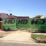 Eye Catching Digital Green Banner Mesh signage for Builders
